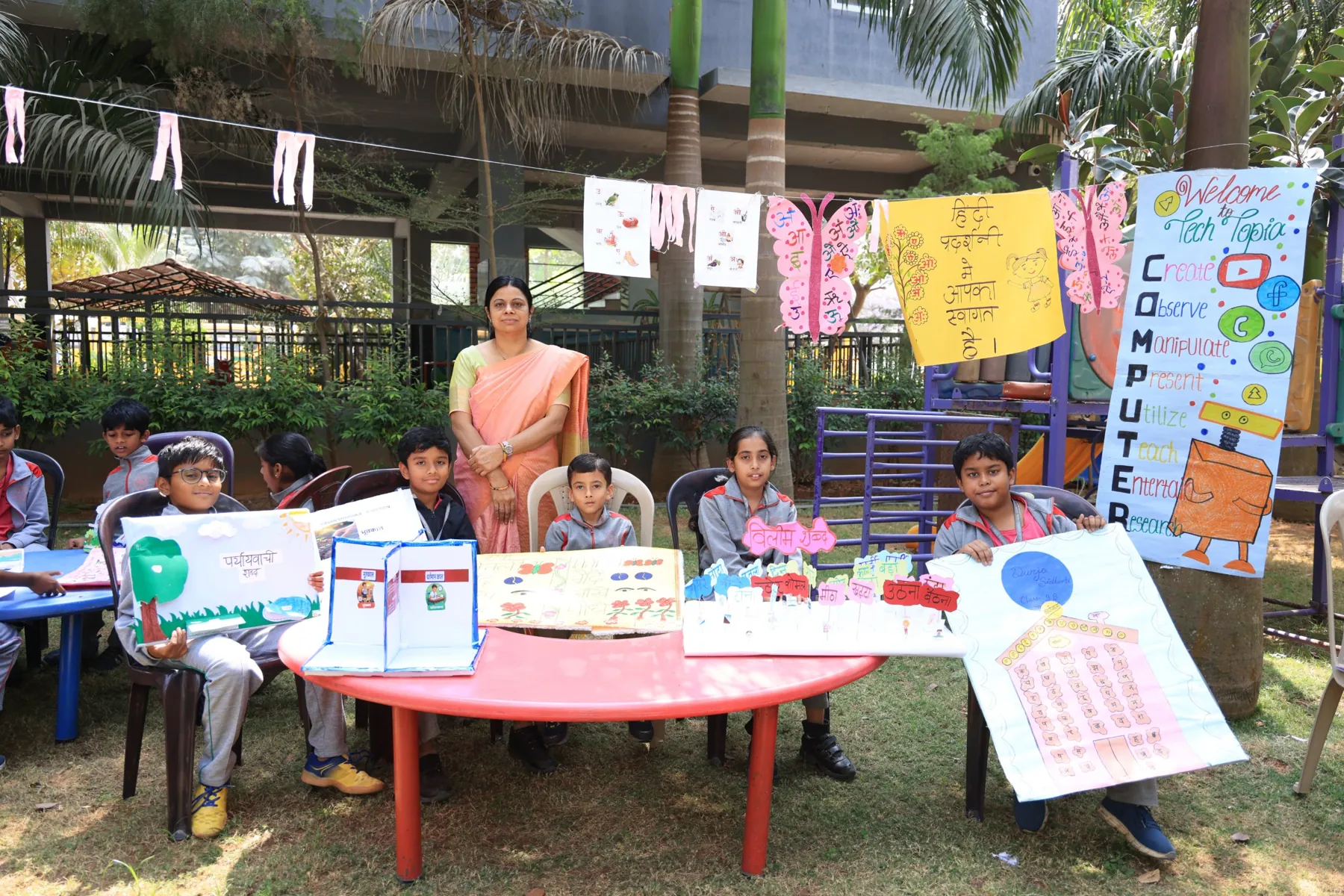 Students presenting at the Hindi and computer exhibition