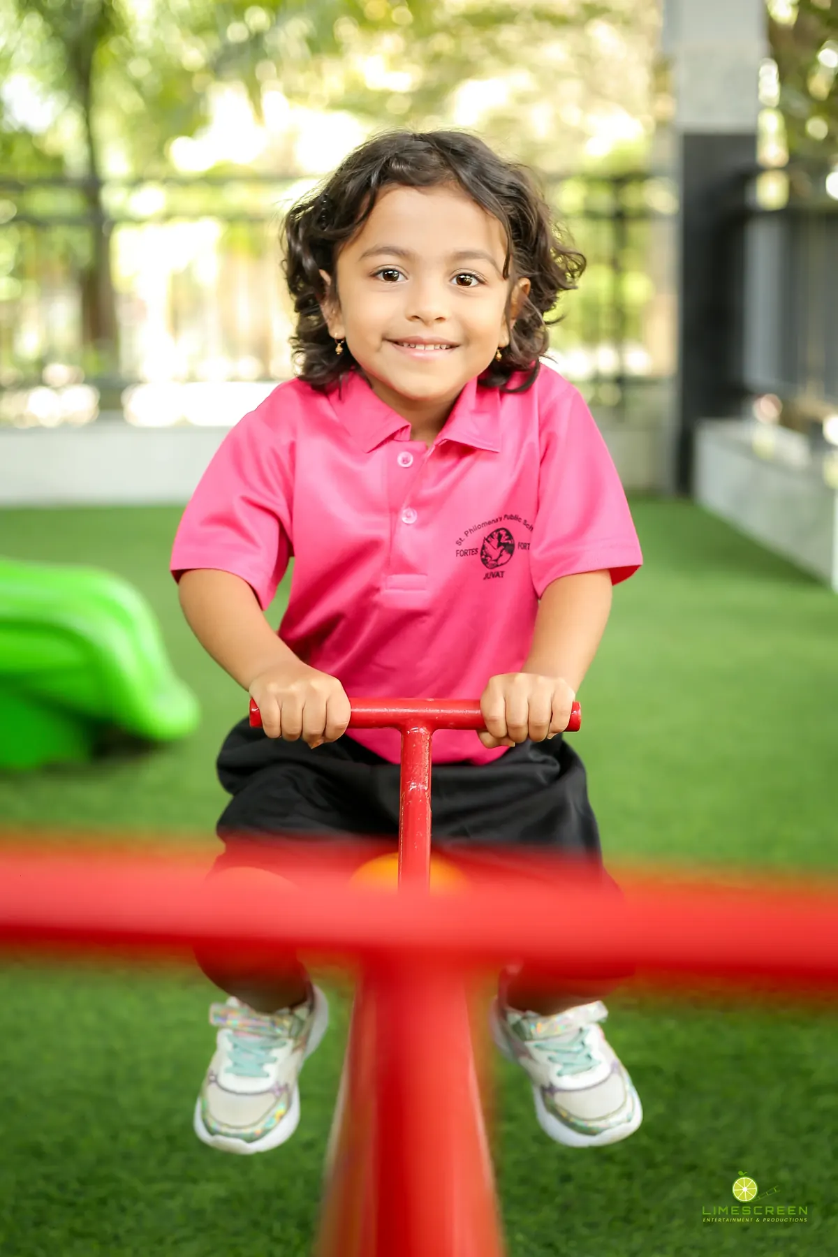 A young child enjoying the early years play area